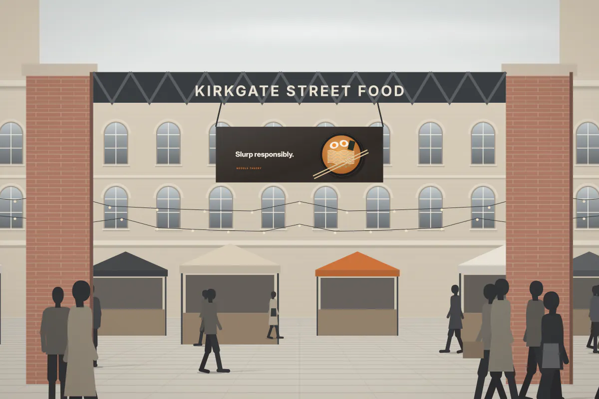 Banner pitch at a weekend street-food market — daytime view